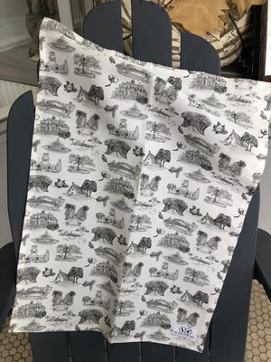 Open image in slideshow, There is a tea towel made of black and white Toile of Tallahassee fabric.
