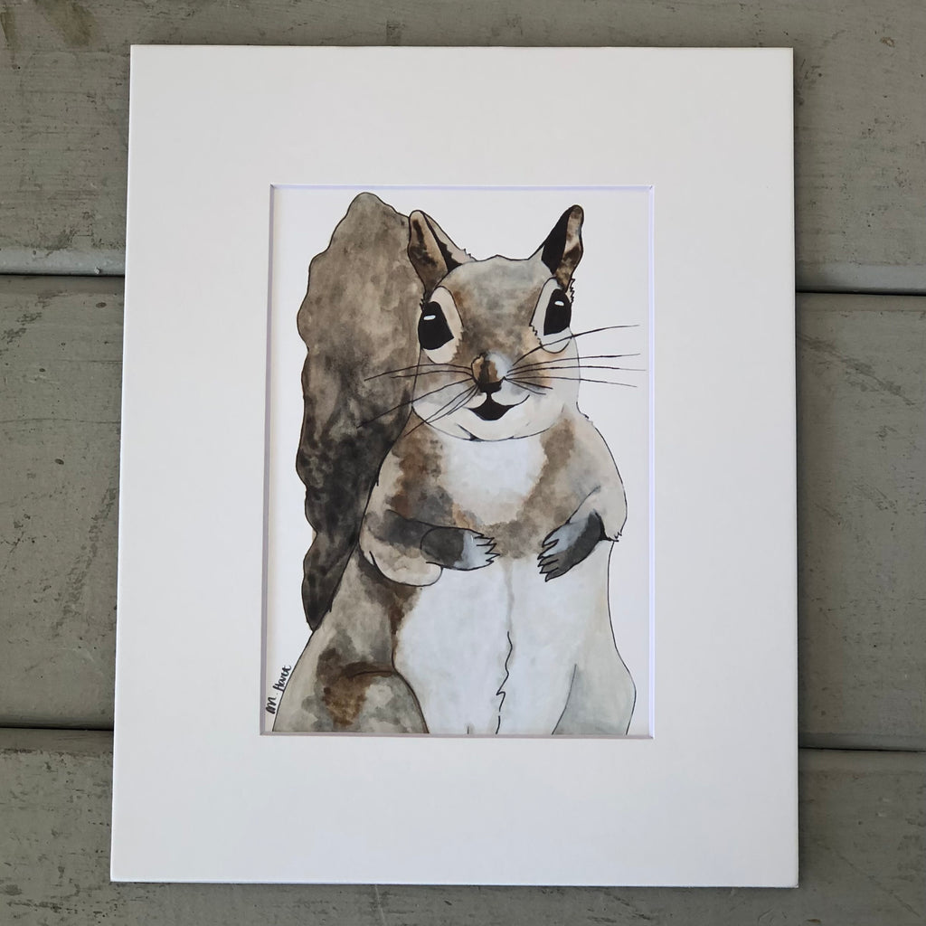 Pictured is a print designed by artist Maddie Hart and sold at The Hare & The Hart in downtown Thomasville, Georgia. It is an 5" x 7", matted to 8" x 10", print of a watercolor squirrel.