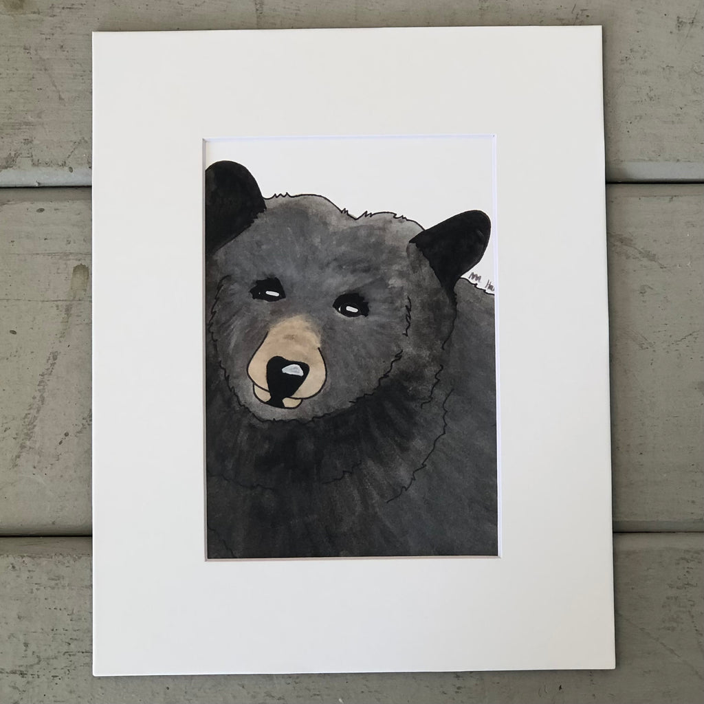 Pictured is a print designed by artist Maddie Hart and sold at The Hare & The Hart in downtown Thomasville, Georgia. It is an 5" x 7", matted to 8" x 10", print of a watercolor black bear.