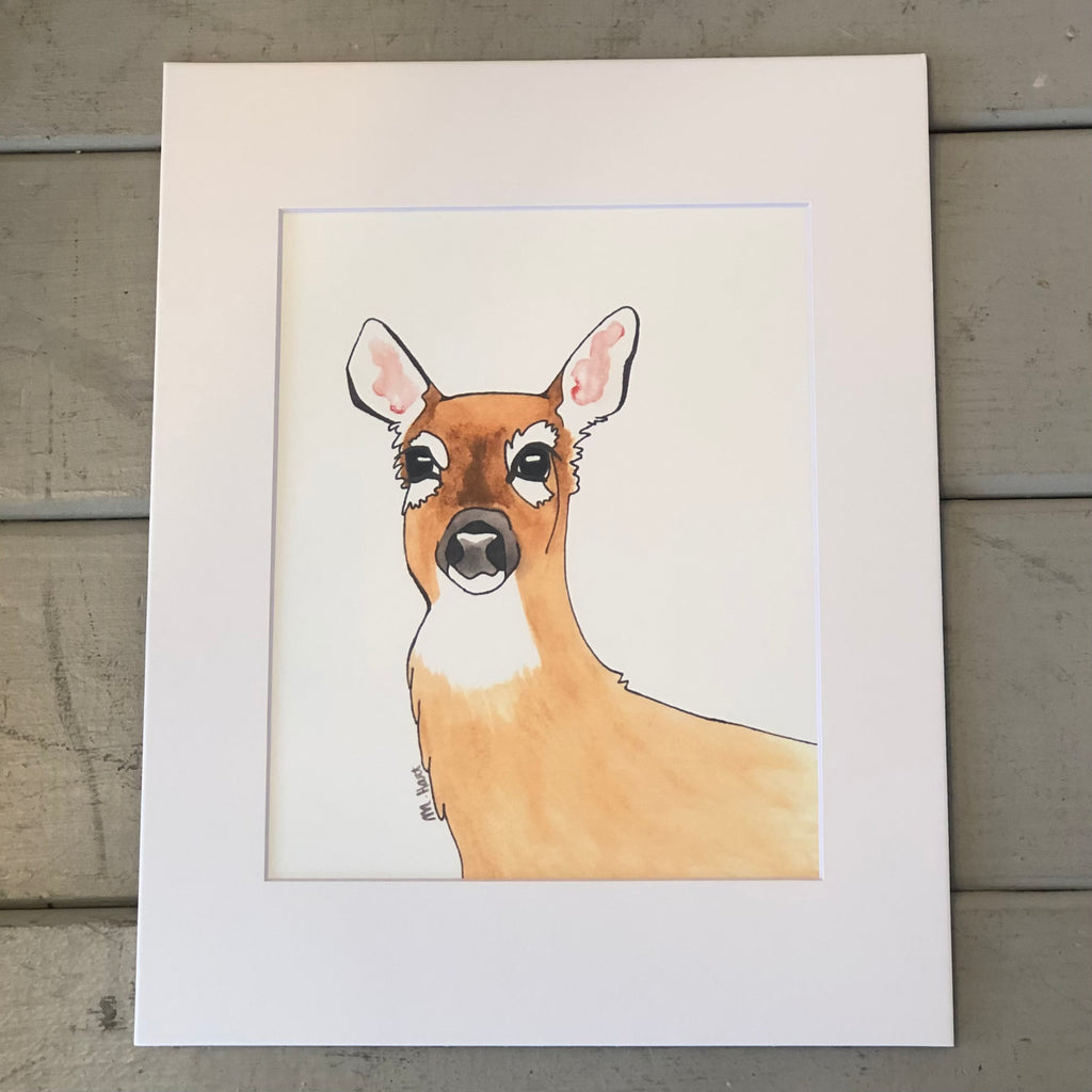 Pictured is a print designed by artist Maddie Hart and sold at The Hare & The Hart in downtown Thomasville, Georgia. It is an 8" x 10", matted to 11" x 14" print of a watercolor doe.