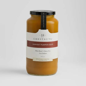 Pictured is a jar of 18 Chestnuts Harvest Pumpkin Soup sold at The Hare & The Hart in downtown Thomasville, Georgia. The soup is orange with a label that reads, "plant based, gluten free, low sodium"