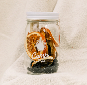 Pictured is a Sangria Camp Craft Cocktail sold at The Hare & The Hart in downtown Thomasville, Georgia. It is a clear glass mason jar filled with dry ingredients for the cocktail.