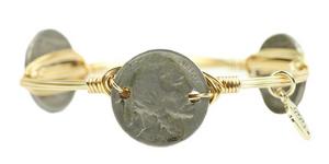 Pictured is a Buffalo Nickle Bangle Bracelet by Bourbon and Bowties sold at The Hare & The Hart in downtown Thomasville, Georgia. It is a gold plated copper wire-wrapped bangle adorned with three buffalo nickels.