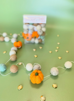 Pictured is a Pumpkins Wool Felt Ball Garland by The Mad Padder and sold at The Hare & The Hart in downtown Thomasville, Georgia.