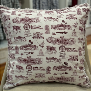 Pictured is a square pillow covered with Toile of FSU garnet and white patterned fabric. The edges of the pillow are frayed.