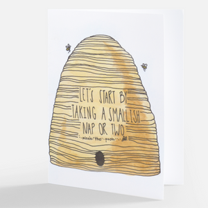 Pictured is a notecard with watercolor artwork by the artist Maddie Hart printed on the front of it. It is sold at The Hare & The Hart in downtown Thomasville, Georgia. The artwork is a bee hive with script over it. The script reads, "LET'S START BY TAKING A SMALLISH NAP OR TWO - Winne-the-Pooh"
