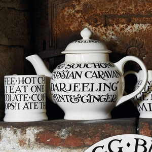 Pictured is Black Toast Teapot by Emma Bridgewater sold at The Hare & The Hart in downtown Thomasville, Georgia. It is a teapot with the words, "SOUCHONG RUSSIAN CARAVAN DARJEELING MINT & GINGER"