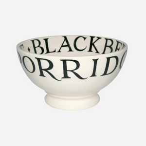 Pictured is a Black Toast French Bowl by Emma Bridgewater sold at The Hare & The Hart in downtown Thomasville, Georgia. The outside of the bowl reads, "PORRIDGE & CREAM"