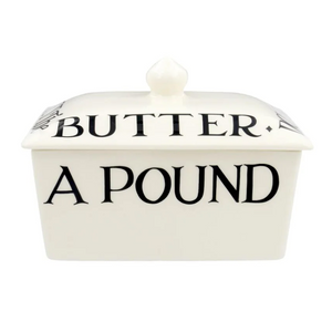 Pictured is a Black Toast Butter Dish by Emma Bridgewater sold at The Hare & The Hart in downtown Thomasville, Georgia. It is a ceramic butter dish with a lid that says, "DON'T LET THE CAT GET The BUTTER"
