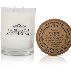 Pictured is a Espresso + Dark Chocolate Soy Wax Candle by Seventh Avenue Apothecary sold at The Hare & The Hart in downtown Thomasville, Georgia. It is a candle with white wax and a clear glass jar.