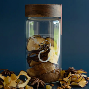 Pictured is Smoked Harvest by Infuse & Booze sold at The Hare & The Hart in downtown Thomasville, Georgia. It is a glass jar with a wooden lid filled with cocktail ingredients.