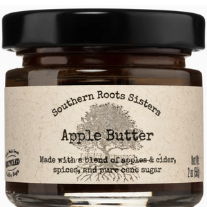 Pictured is Apple Butter by Southern Root Sisters sold at The  Hare & The Hart in downtown Thomasville, Georgia. It is a small jar of Apple Butter with a description that reads, "Made with a blend of apples & cider, spices, and pure cane sugar."