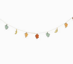 Pictured is a Autumn Leaves Wooden Garland sold at The Hare & The Hart in downtown Thomasville, Georgia. It is a garland with four different designs of leaves.