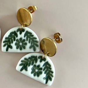 Pictured is Green Fanfare Dangle Earrings sold at The Hare & The Hart in downtown Thomasville, Georgia.