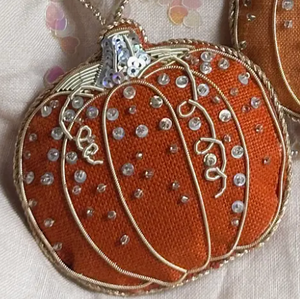 Open image in slideshow, Pictured is a Handmade Irish Linen Pumpkin Ornament sold at The Hare &amp; The Hart in downtown Thomasville, Georgia. It is an orange pumpkin ornament.
