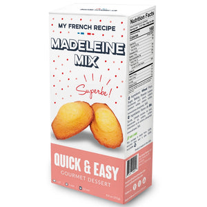 Pictured is a box of My French Recipe Madeleine Mix sold at The Hare & The Hart in Thomasville, GA. The box has an image of two madeleines leaning against one another. The box reads, "MY FRENCH RECIPE MADELEINE MIX QUICK & EASY GOURMET DESSERT Superbe!"