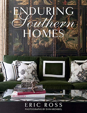 Pictured is the book "Enduring Southern Homes" by Eric Ross sold at The Hare & The Hart in Thomasville, GA. The cover features a photo by Evin Krehibiel of a green velvet couch with a tapestry behind it.
