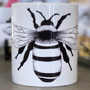 A large white bug with a black bee design. This is a Large Mug by Birds & Bees sold at The Hare & The Hart.