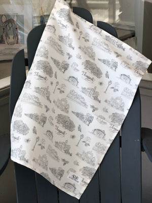 Open image in slideshow, There is a tea towel made of black and white Toile of Thomasville fabric.
