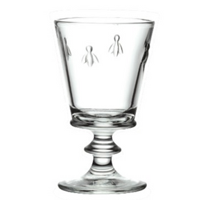 A clear wine glass with four bees embossed on it. This is a Bee Wine Glass by La Rochere sold at The Hare & The Hart.