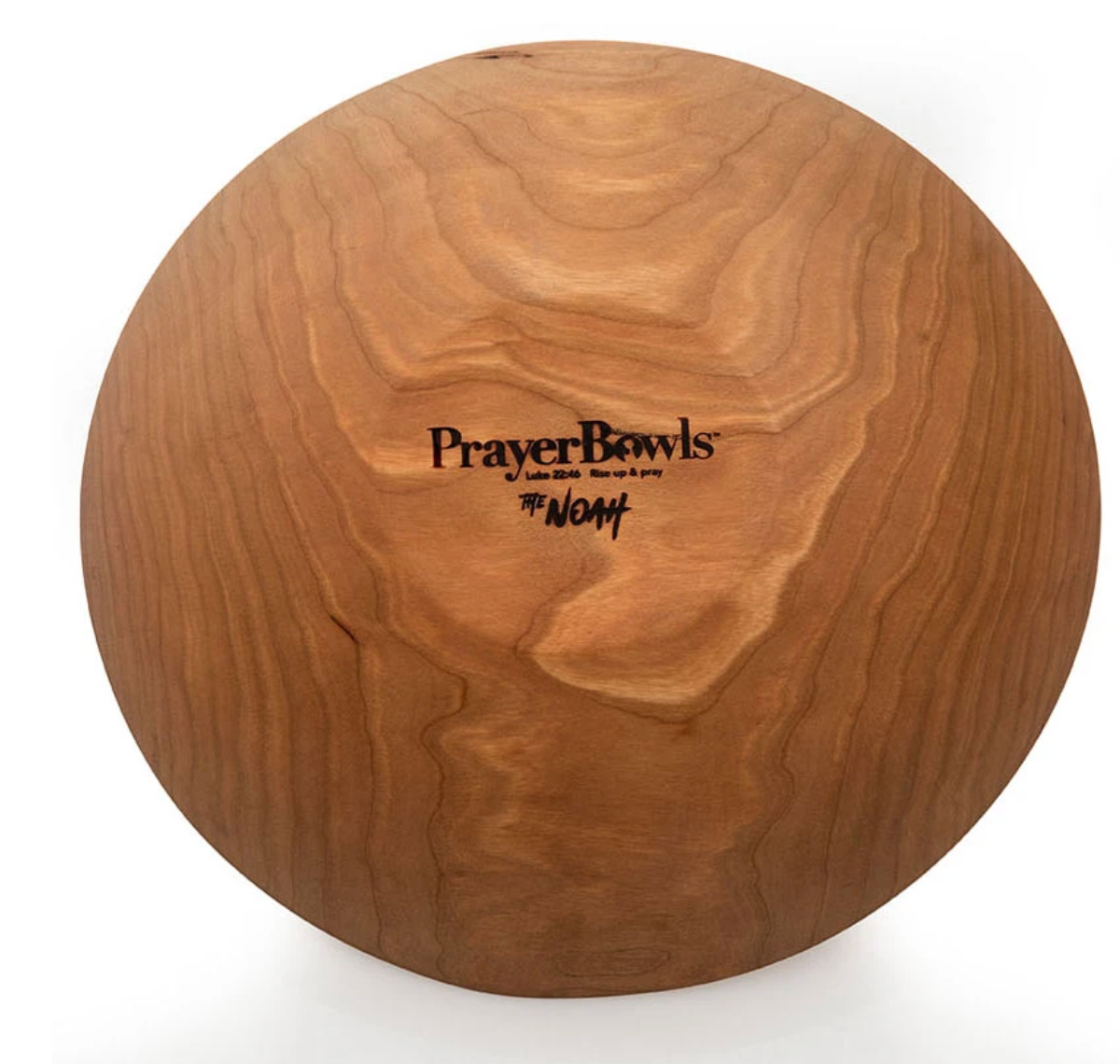 Pictured is the bottom of the Noah Prayer Bowl. Pressed into the base is the Prayer Bowls logo.