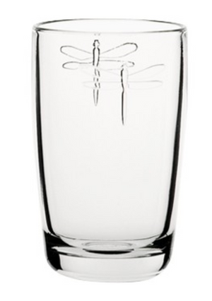 A tall juice glass with two dragonflies embossed on it. This is a Dragonfly Juice Glass by La Rochere sold at The Hare & The Hart.