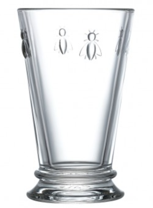 A clear glass iced tea glass with four embossed bees on opposite sides. There is a Bee Iced Tea Glass by La Rochere sold at The Hare & The Hart.
