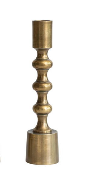 Pictured is an Antique Gold Finish Taper Holder in 8 Inch Size sold at The Hare & The Hart in downtown Thomasville, Georgia.