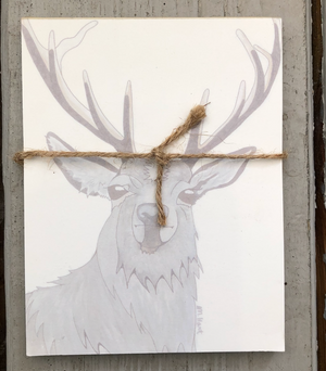 Open image in slideshow, There is a notepad tied together with twice. The paper of the notepad is printed with a design of a stag.

