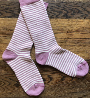 Pictured is a pair of Samantha Holmes Alpaca Stripey Socks in pink. These are sold at The Hare & The Hart in Thomasville, GA.