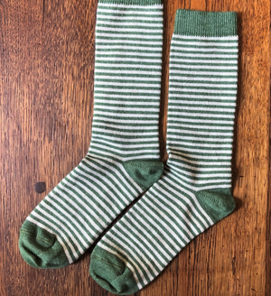 Open image in slideshow, Pictured is a pair of Samantha Holmes Alpaca Stripey Socks in green. These are sold at The Hare &amp; The Hart in Thomasville, GA.
