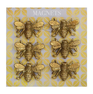 Pictured are 6 pewter bee magnets attached to a metal backing.